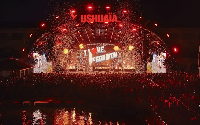 Performance of I Love Reggaeton at Ushuaïa Ibiza with vibrant lights and crowd.