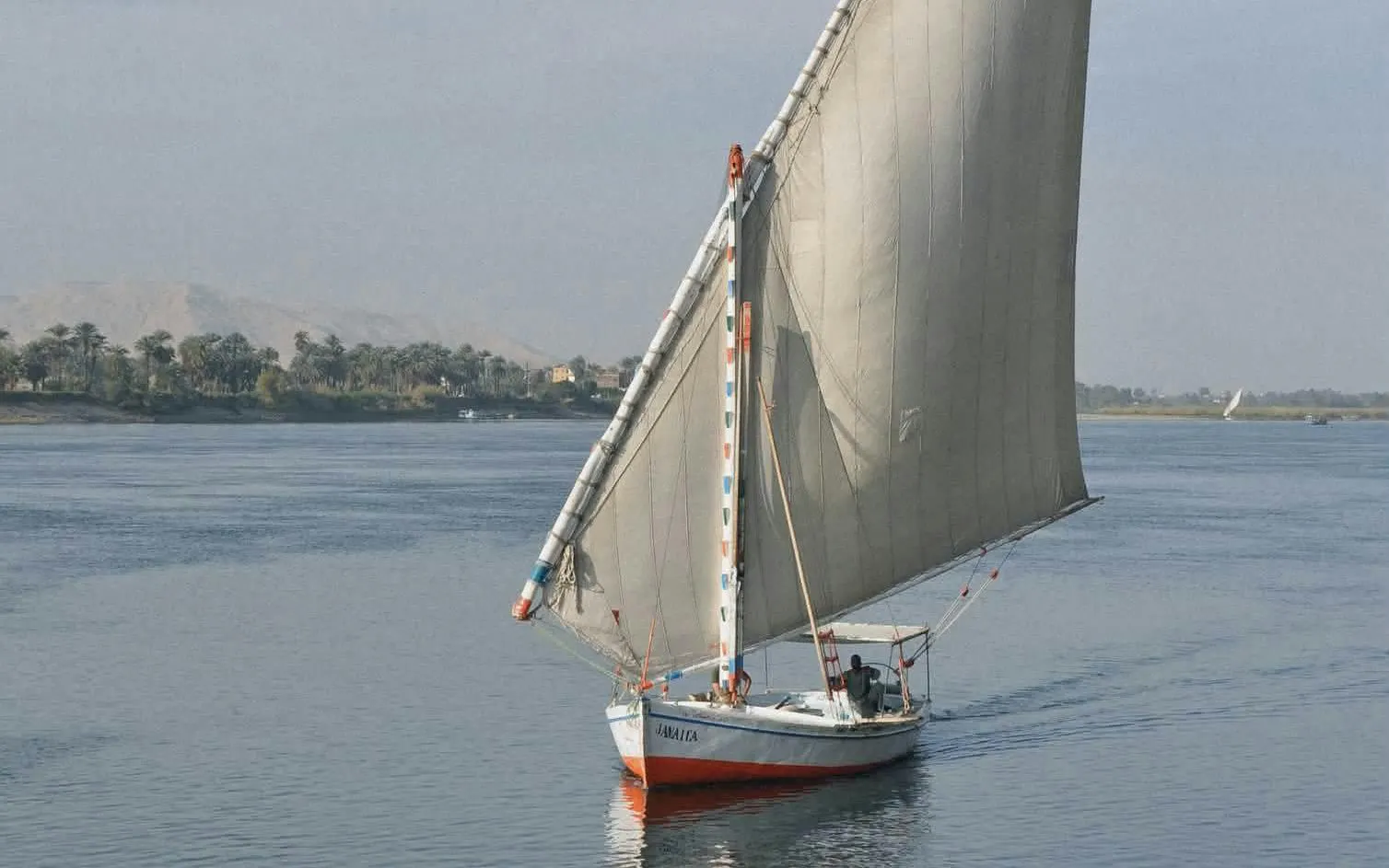 Felucca sailing on the Nile River during a Cairo evening tour.