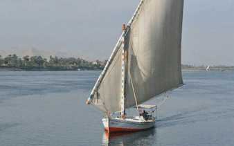 Felucca sailing on the Nile River during a Cairo evening tour.