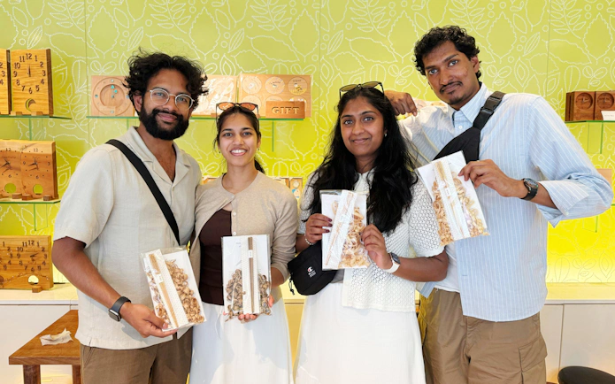 Participants holding handmade chopsticks at a workshop in Ginza.