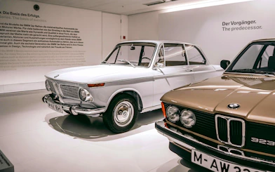 Vintage BMW cars displayed at the BMW Museum in Munich.