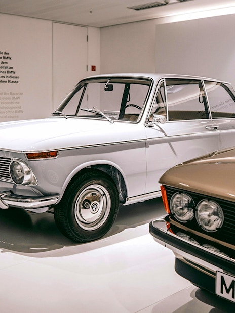 Vintage BMW cars displayed at the BMW Museum in Munich.