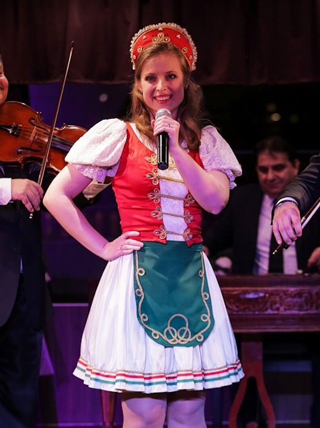 Musicians and singer performing traditional folk music on a Budapest dinner cruise.