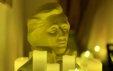 Bust of Chopin surrounded by candles at Chopin Gallery, Krakow.
