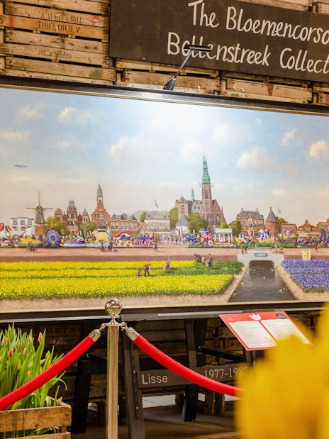Art exhibition featuring Bloemencorso Bollenstreek paintings at Tulip Experience Amsterdam.