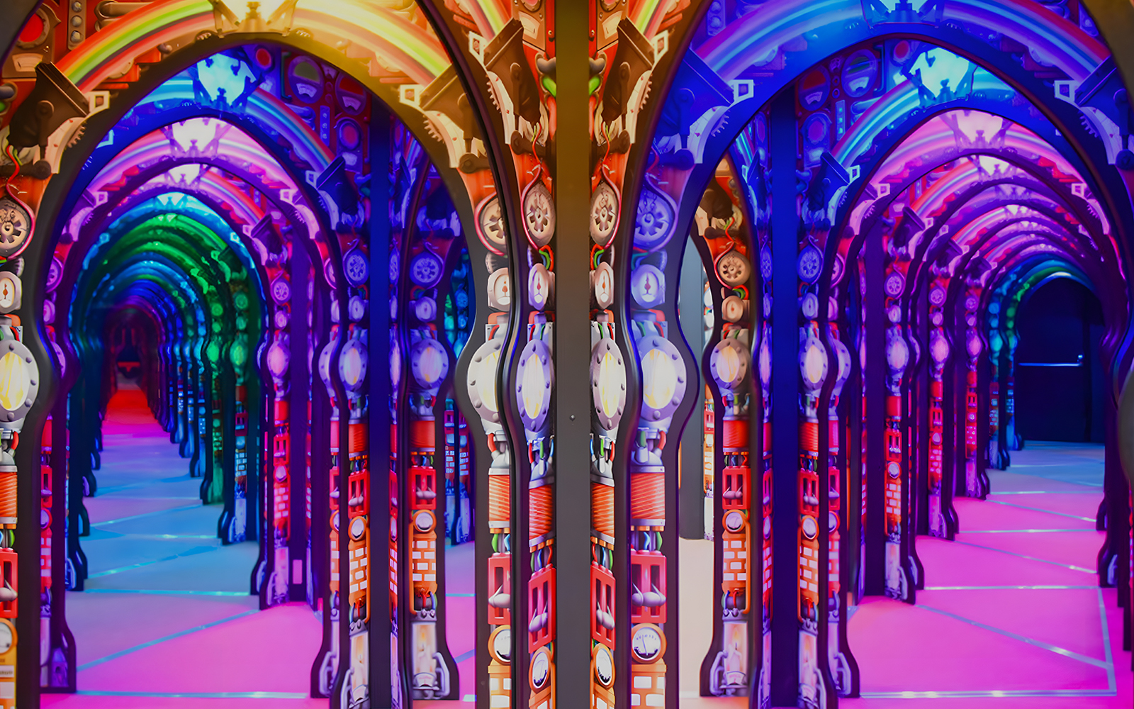 Colorful mirrored arches at Science Centre Singapore exhibit.