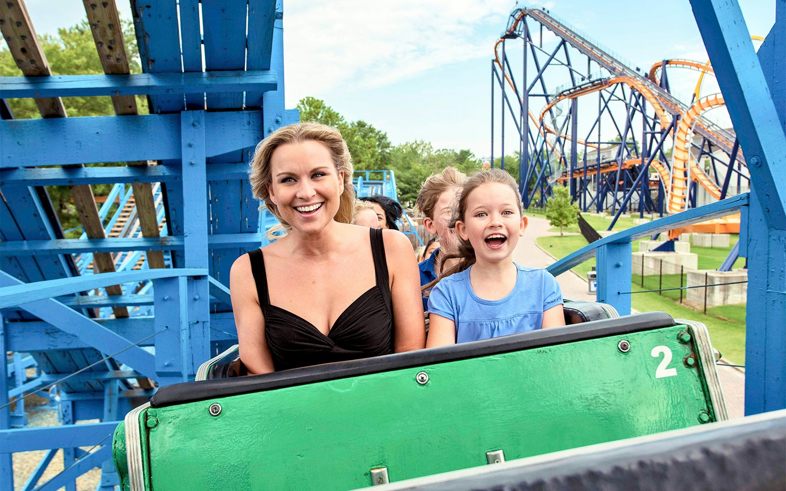Riders enjoying the Woodstock Express roller coaster at Six Flags King's Dominion.