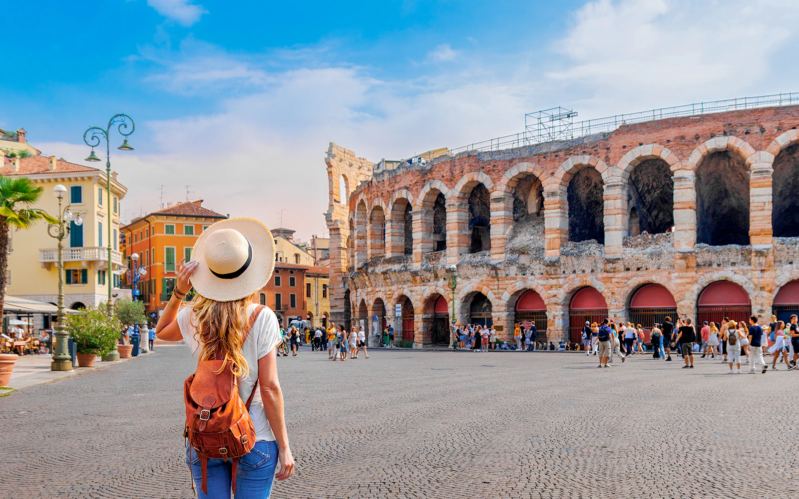 Backpacker tourist at Verona Arena, Italy, exploring the historic amphitheater.
