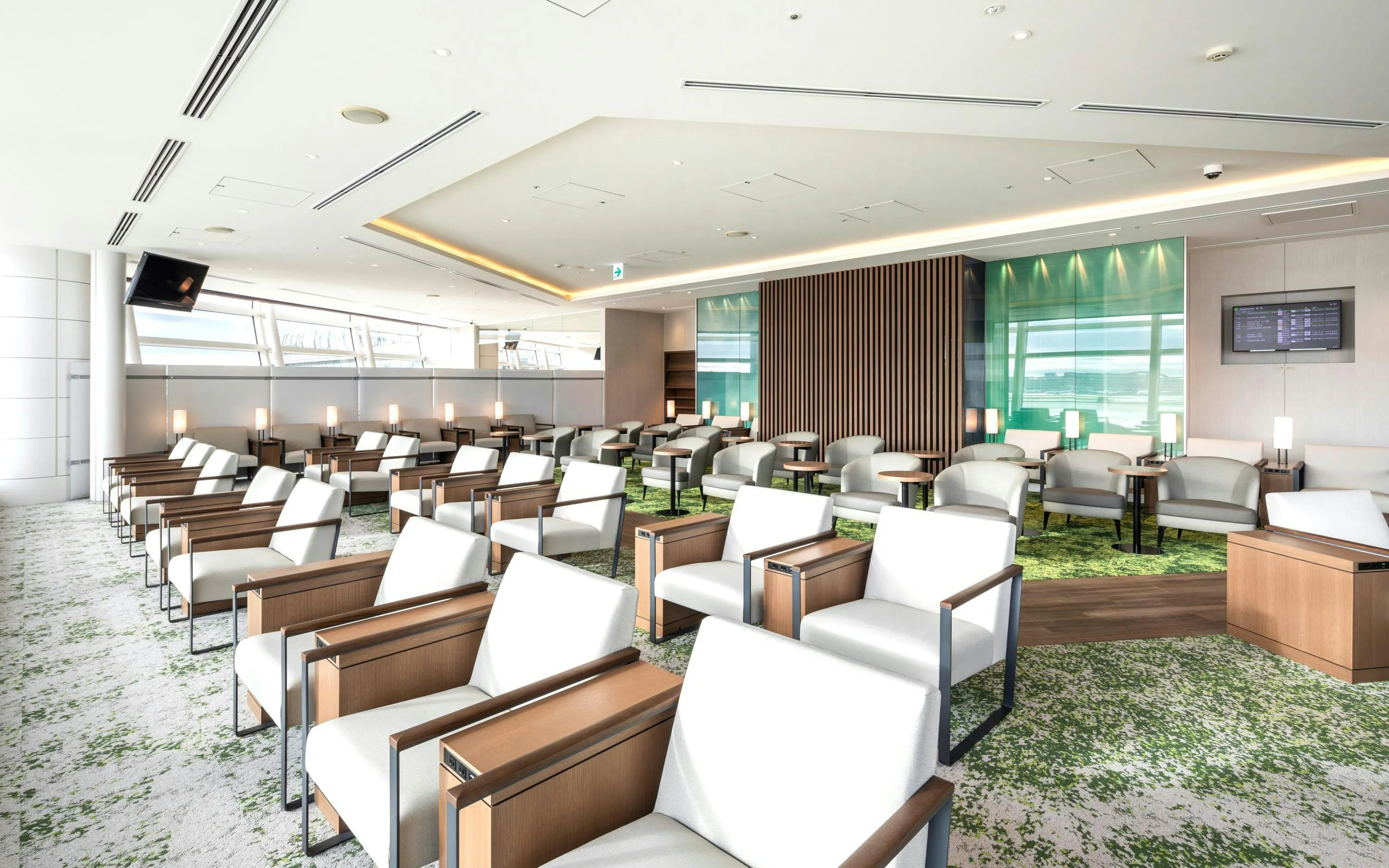 TIAT Lounge seating area at Tokyo International Airport with modern chairs and tables.