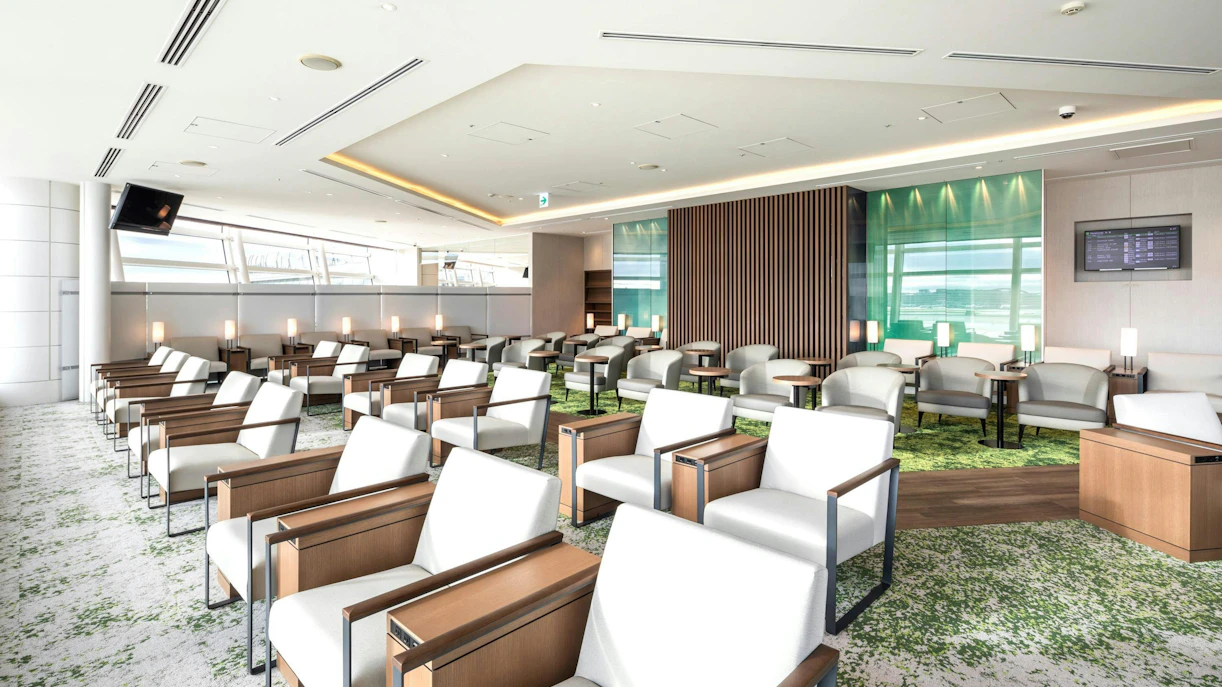 TIAT Lounge seating area at Tokyo International Airport with modern chairs and tables.