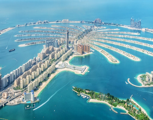 Aerial view of Palm Jumeirah, Dubai, showcasing the palm-shaped island with luxury hotels and residences.
