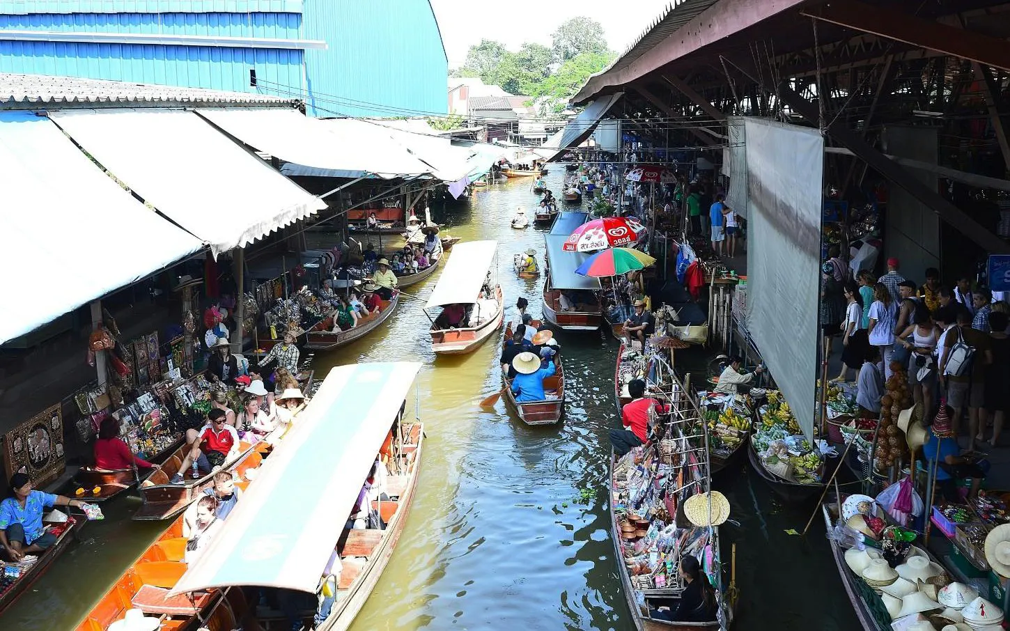 Boats selling goods at Damnoen Saduak Floating Market, part of Ayutthaya tour from Bangkok.