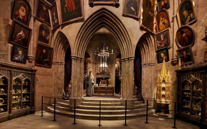 Dumbledore's office with portraits and artifacts at Warner Bros Studio, London.