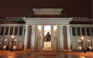 Statue of Velázquez at night in front of the Prado Museum, Madrid.