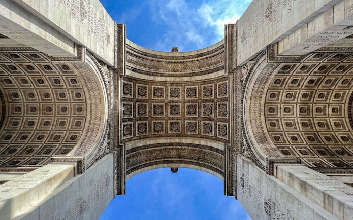 View of the Arc de Triomphe's intricate ceiling in Paris, part of an audio-guided tour.