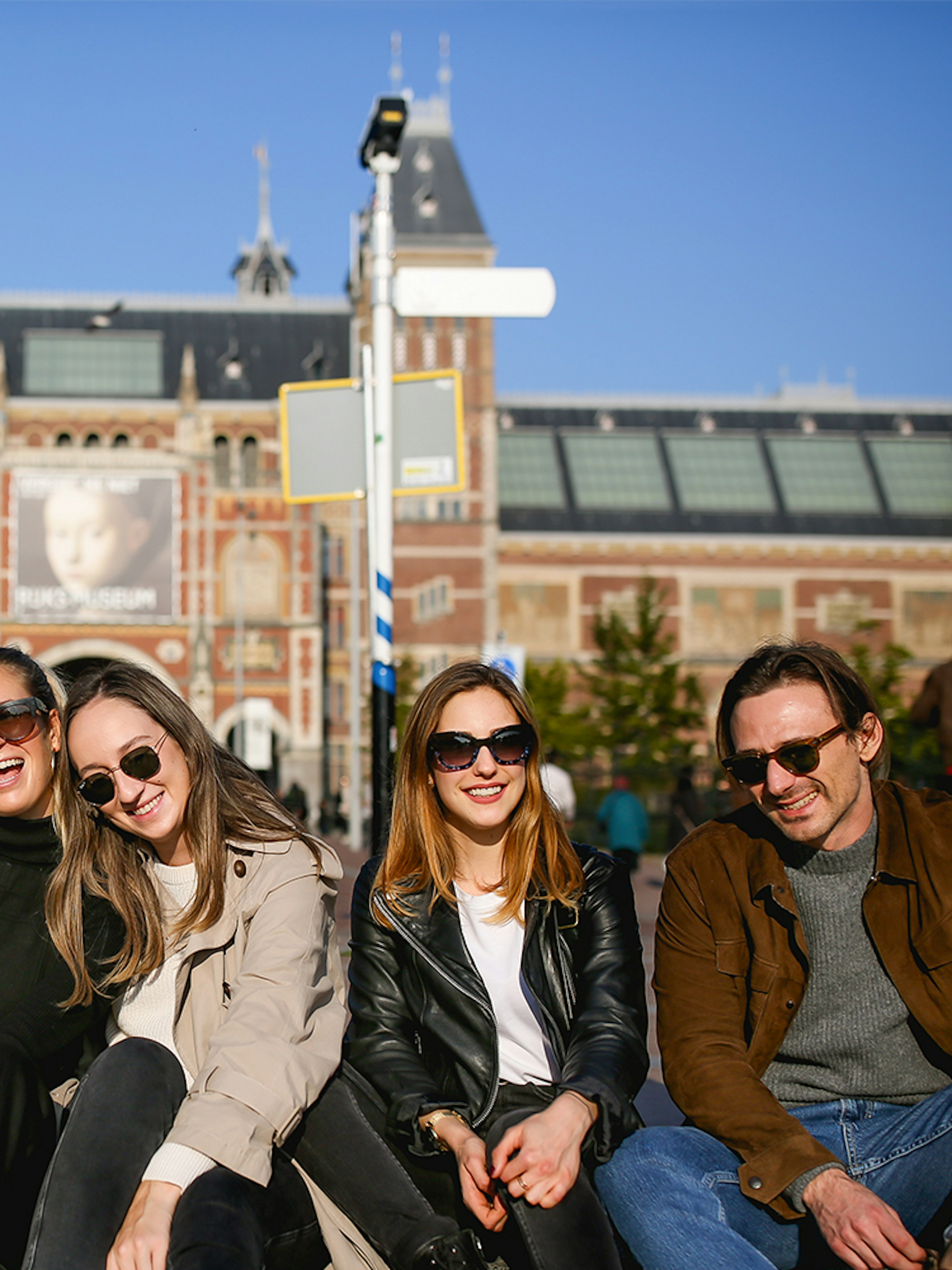 Group enjoying a professional photoshoot in front of the Rijksmuseum, Amsterdam.