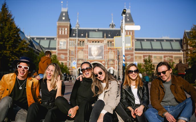 Group enjoying a professional photoshoot in front of the Rijksmuseum, Amsterdam.
