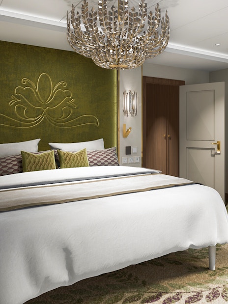 Concierge Suite bedroom with elegant decor, Disney Adventure Cruise.