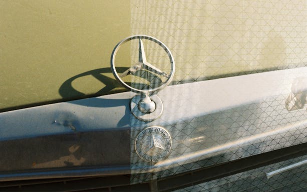Mercedes-Benz hood ornament at KBr Photography Center, Fundación MAPFRE.