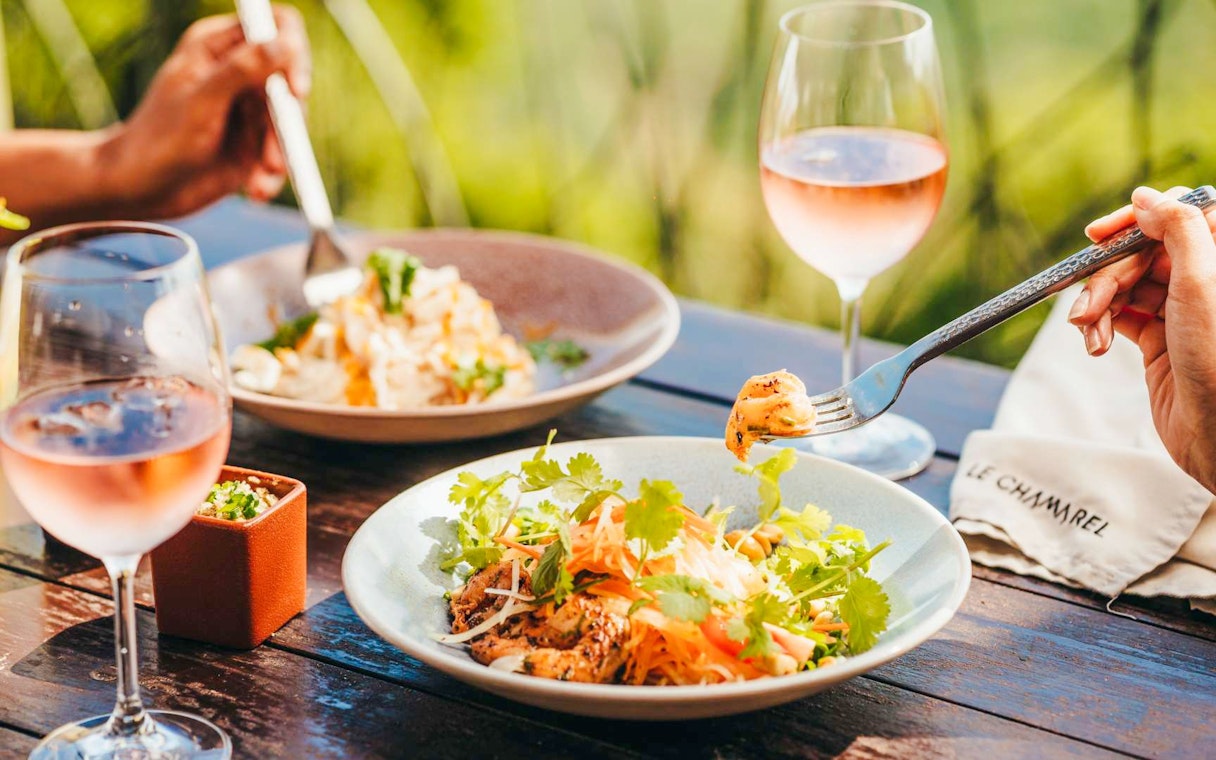 Lunch at Le Chamarel restaurant, Chamarel, Mauritius with salad and wine.