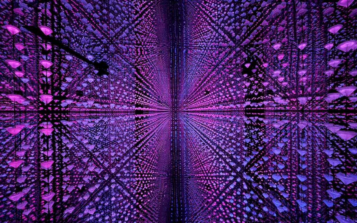 Visitors experiencing digital immersive art at Moco Museum, Barcelona.