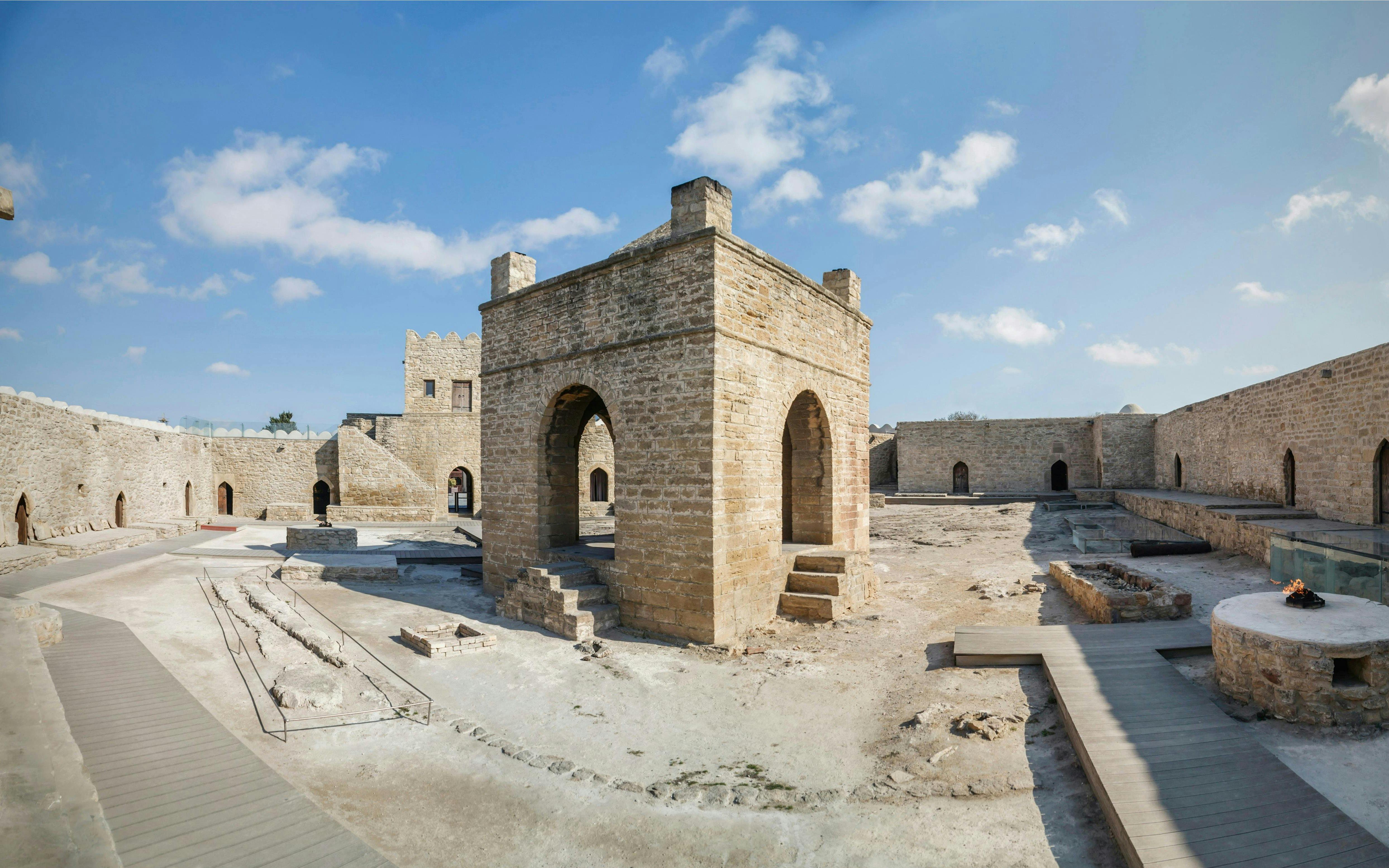 Baku Ateshgah Fire Temple courtyard with stone arches in Surakhani, Azerbaijan.
