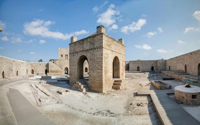 Baku Ateshgah Fire Temple courtyard with stone arches in Surakhani, Azerbaijan.