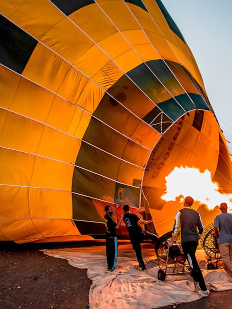 Hot-air balloon inflation for Montserrat tour from Barcelona.