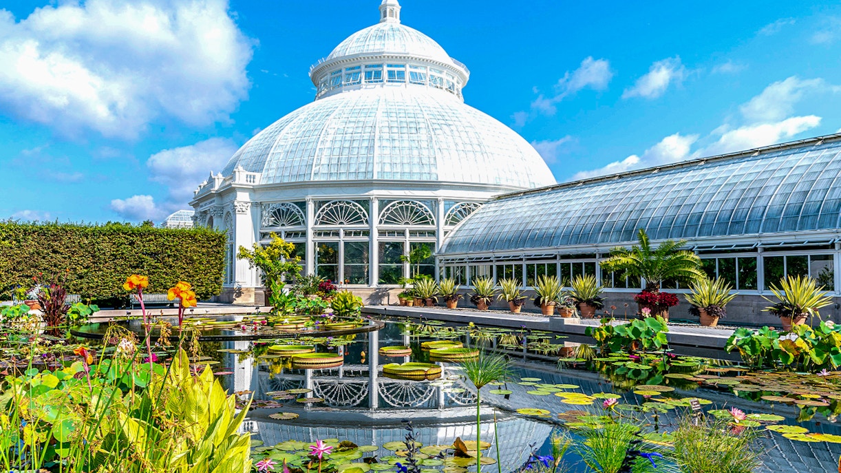 Enid A Haupt Conservatory at New York Botanical Garden with tropical plants and glass dome.