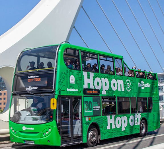 Dublin hop on hop off bus crossing Samuel Beckett Bridge.