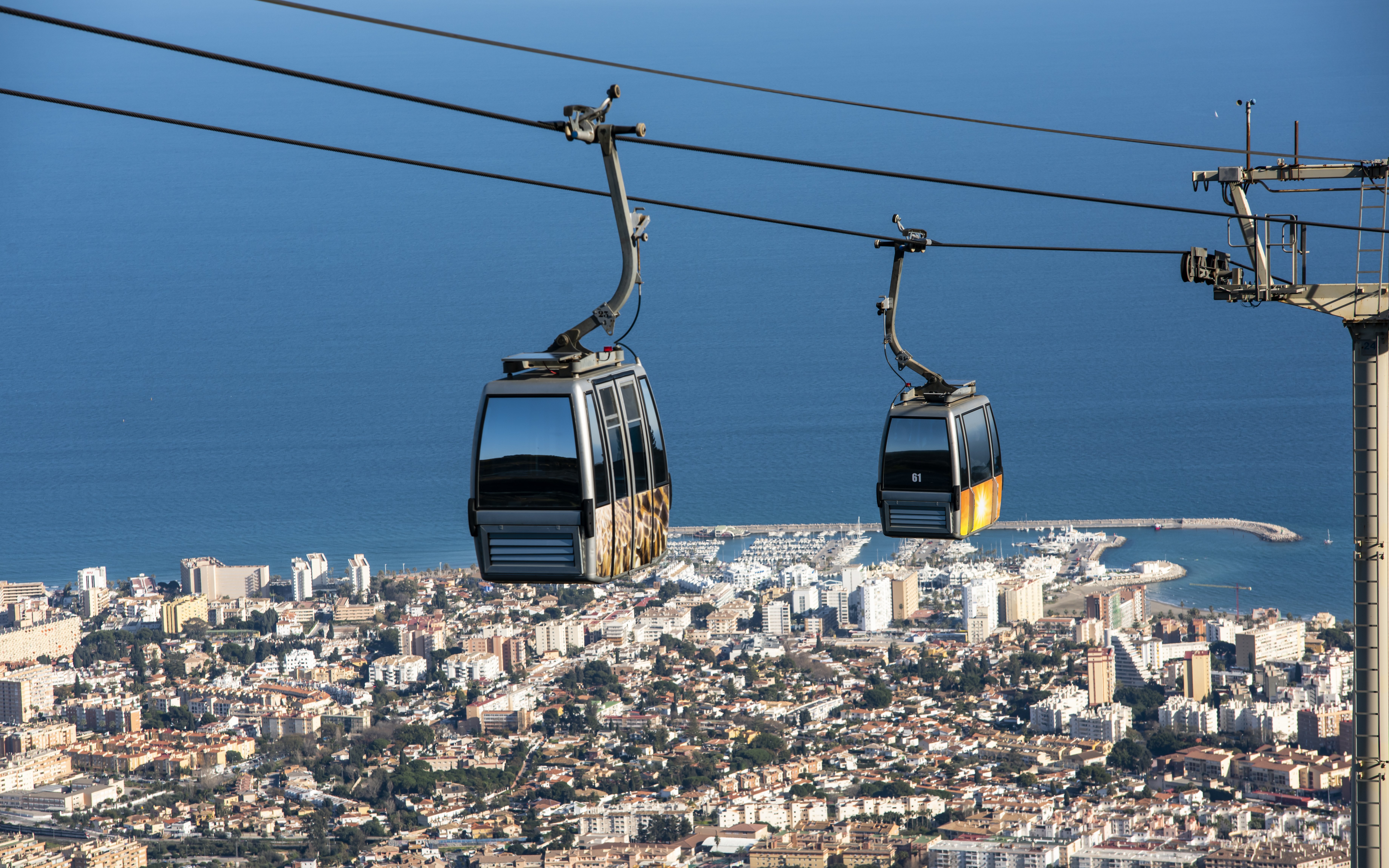 Benalmadena cable car over cityscape and coastline, Malaga, Spain.