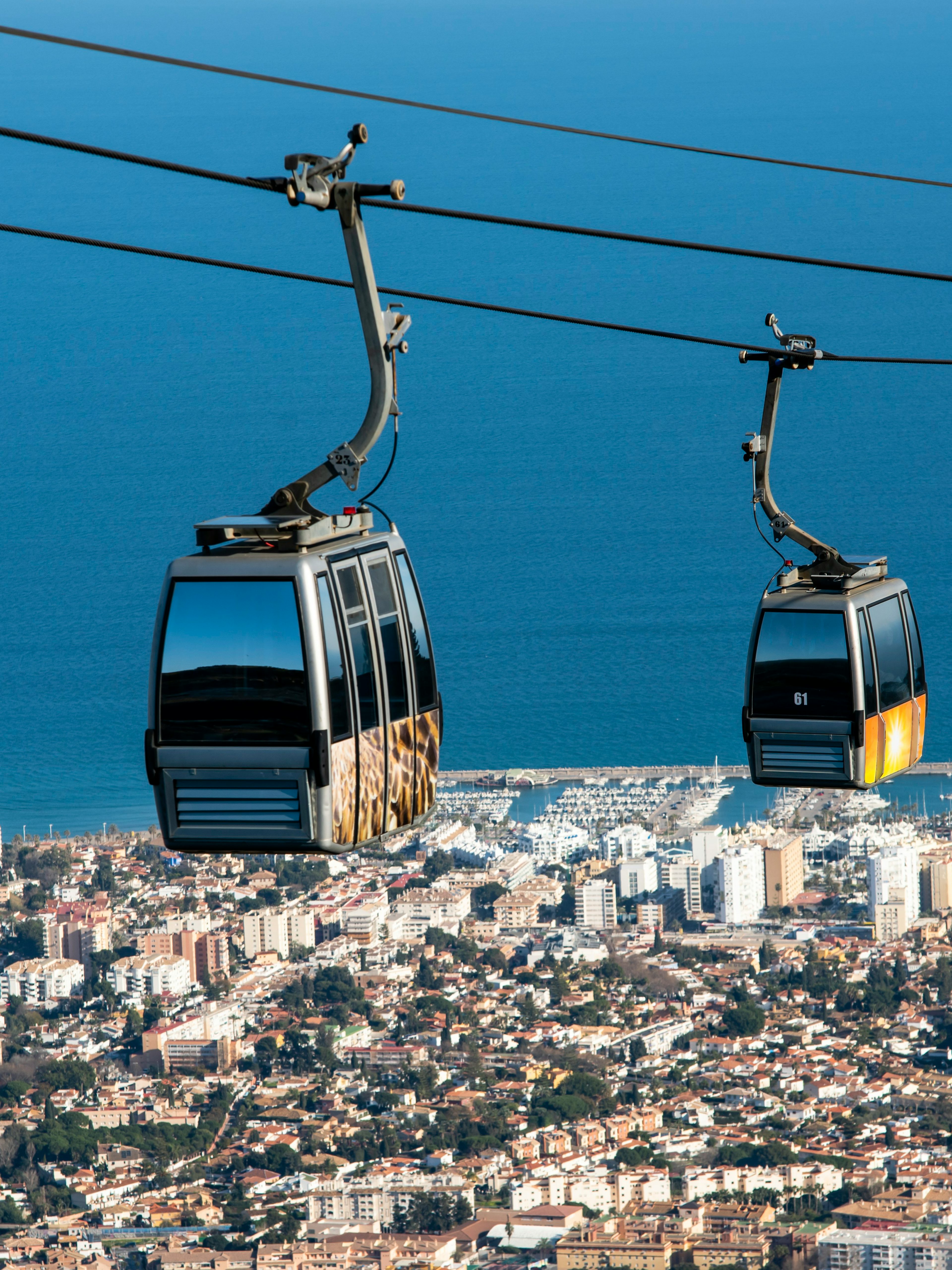 Benalmadena cable car over cityscape and coastline, Malaga, Spain.