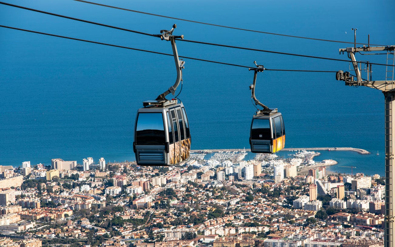 Benalmadena cable car over cityscape and coastline, Malaga, Spain.