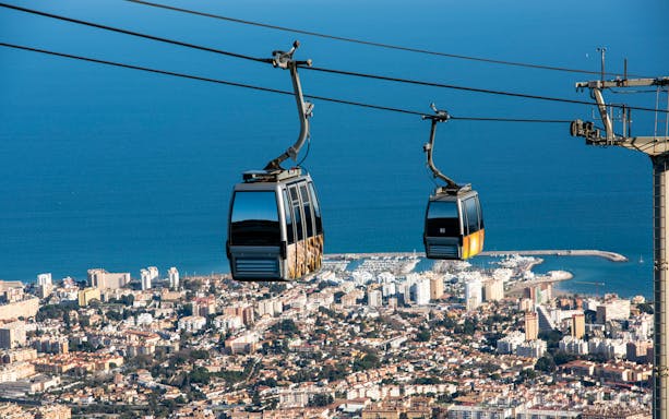 Benalmadena cable car over cityscape and coastline, Malaga, Spain.