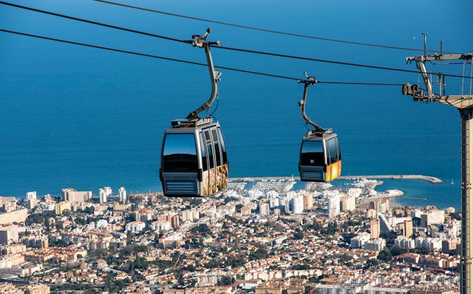Benalmadena cable car over cityscape and coastline, Malaga, Spain.