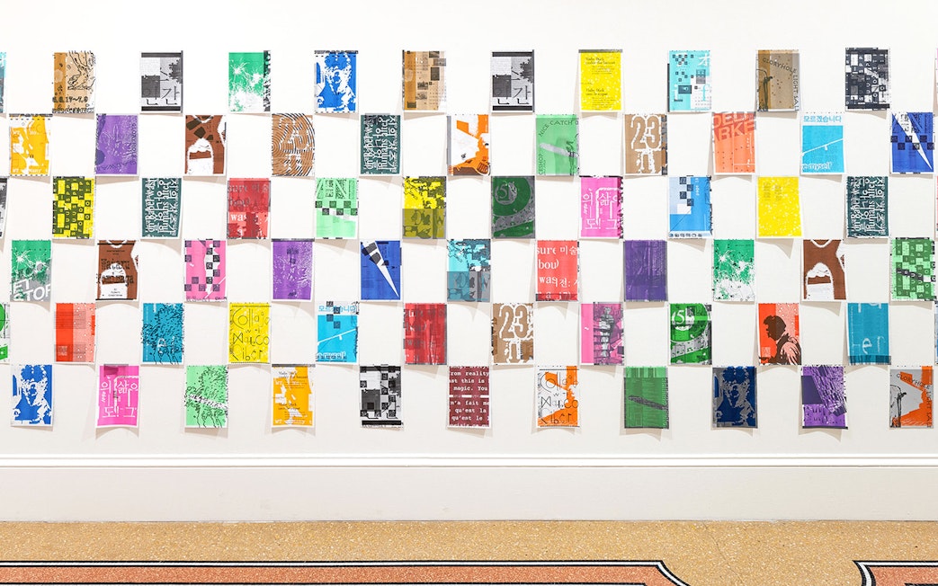 Colorful posters arranged in a grid at Stedelijk Museum's PostNoBills 5 exhibit.