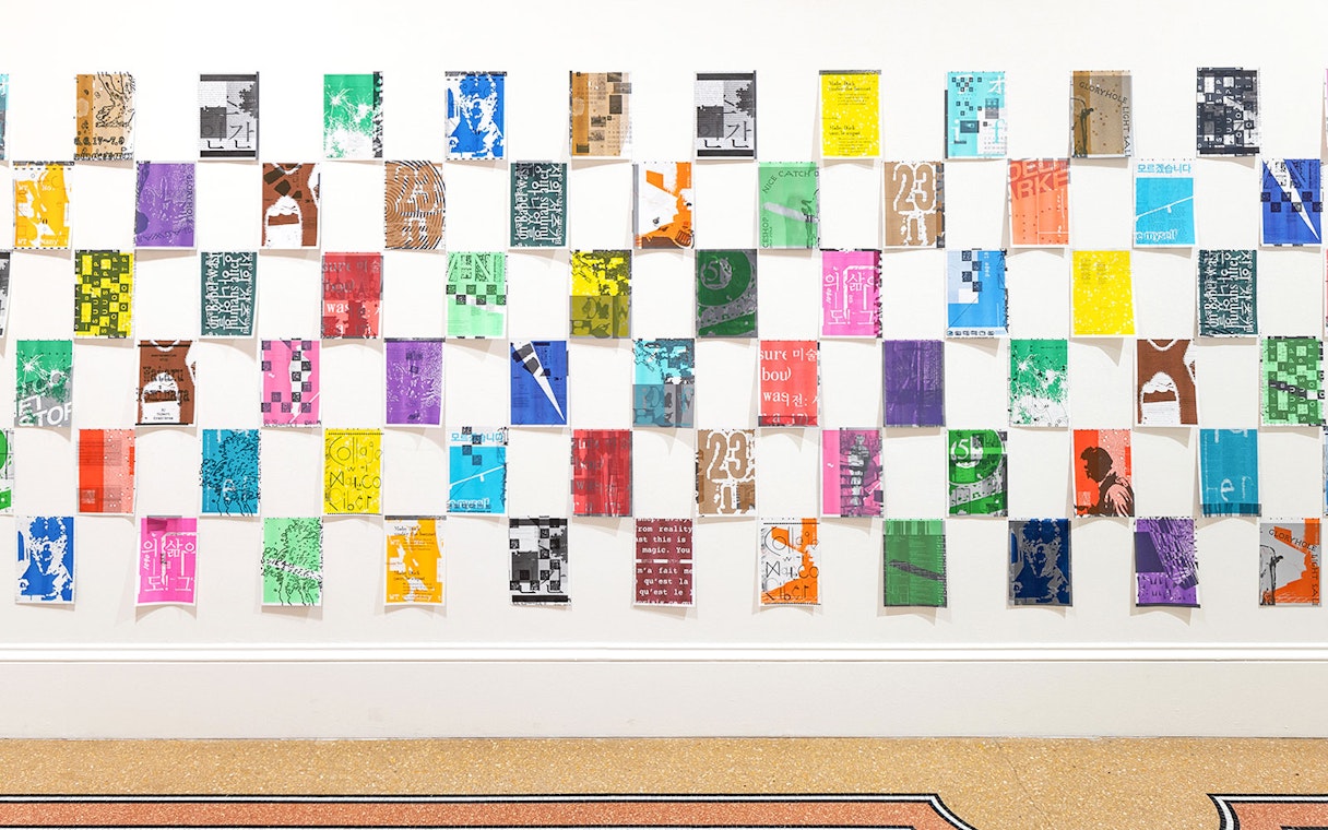 Colorful posters arranged in a grid at Stedelijk Museum's PostNoBills 5 exhibit.