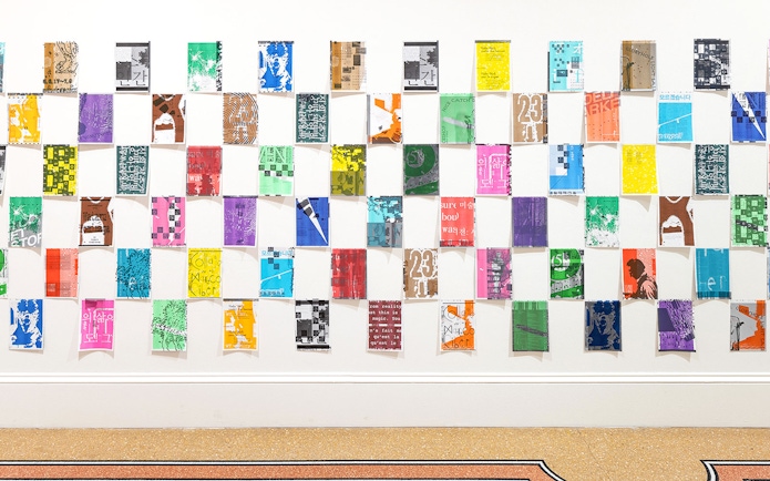 Colorful posters arranged in a grid at Stedelijk Museum's PostNoBills 5 exhibit.