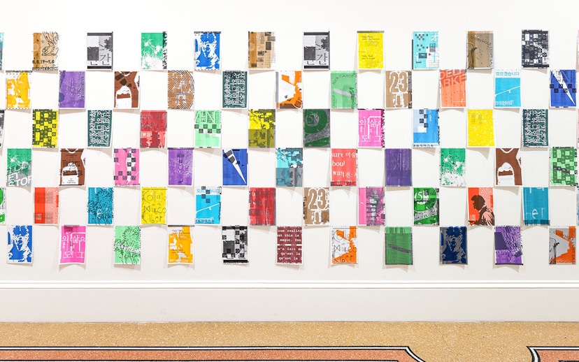 Colorful posters arranged in a grid at Stedelijk Museum's PostNoBills 5 exhibit.