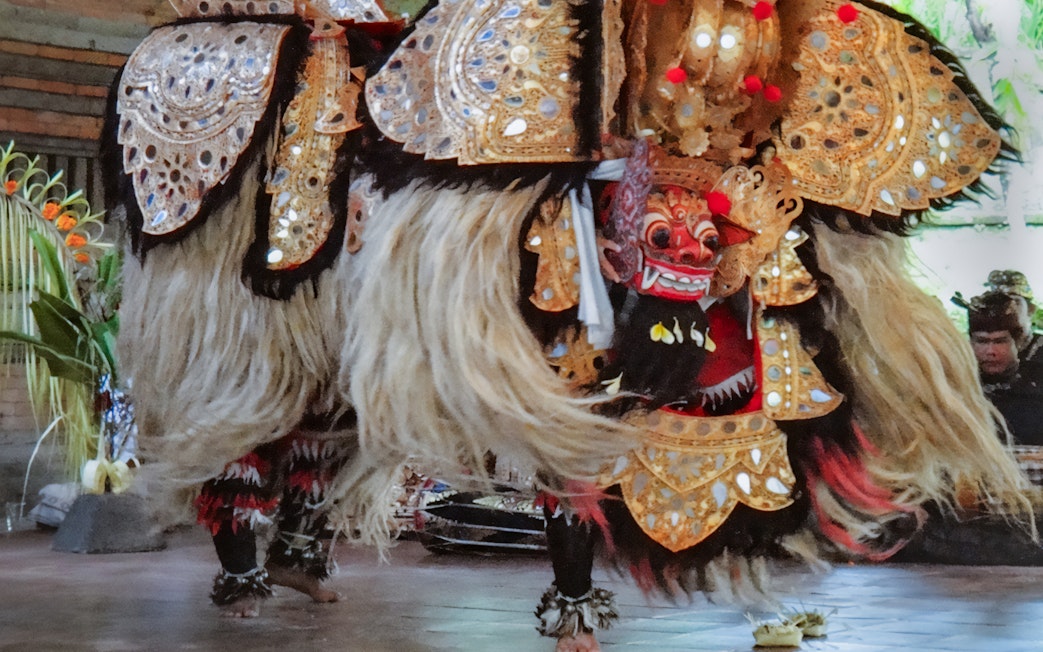 Barong Dance performance at Arma Museum Resort, featuring traditional costumes and masks.
