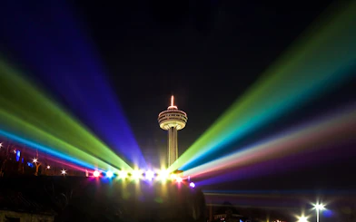 Skylon Tower illuminated by colorful lights during the Festival of Lights, Niagara Falls, Ontario.