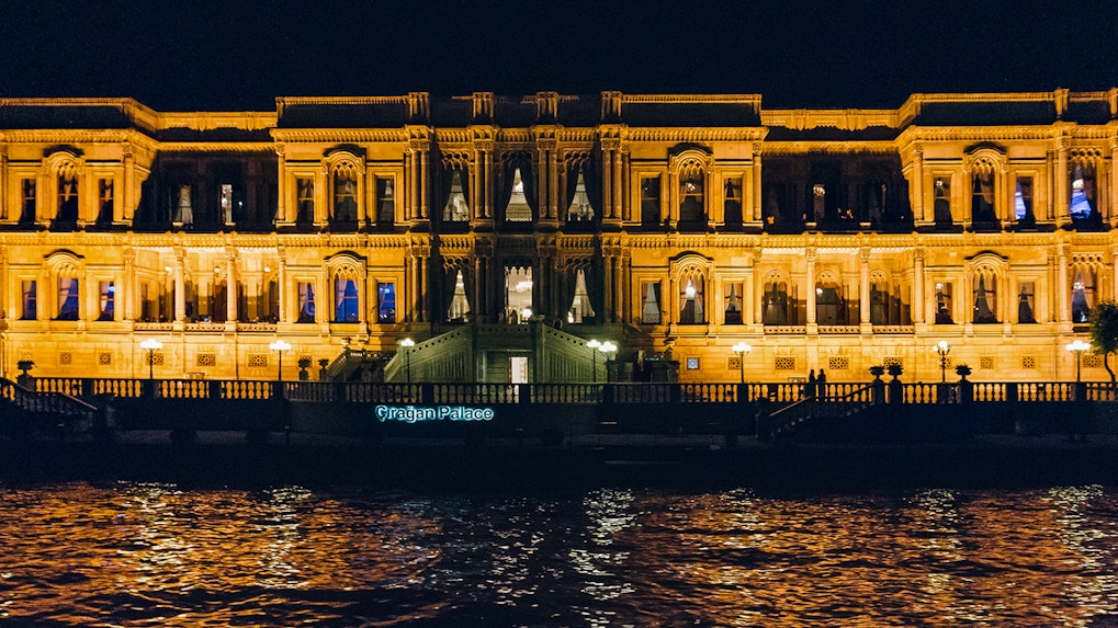 Çırağan Palace illuminated at night, Istanbul, Turkey, viewed from the Bosphorus.