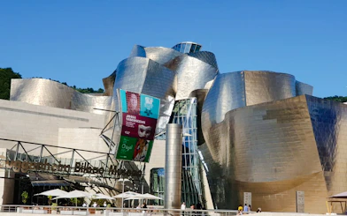Guggenheim Museum Bilbao exterior on a sunny day during a private tour from San Sebastian.