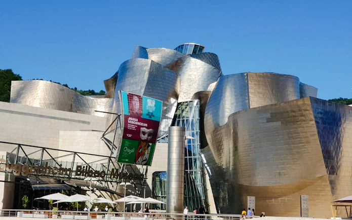 Guggenheim Museum Bilbao exterior on a sunny day during a private tour from San Sebastian.