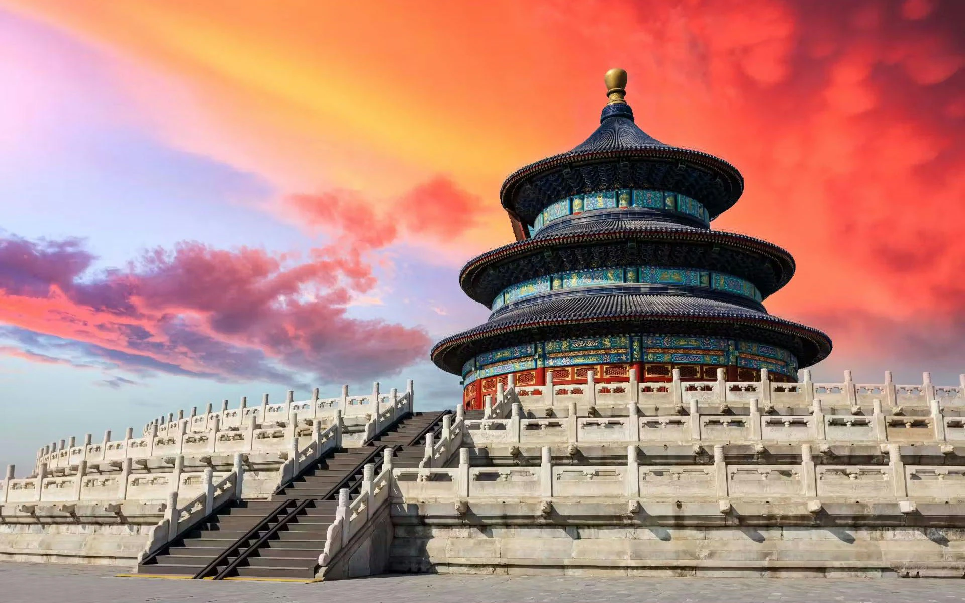 Temple of Heaven in Beijing, China with vibrant sunset sky.