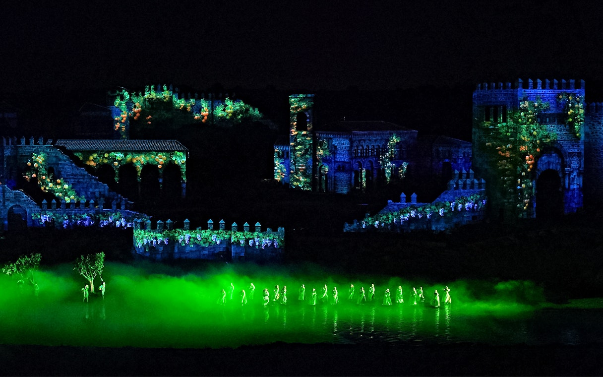 Performers in illuminated costumes at The Dream of Toledo night show, Spain.