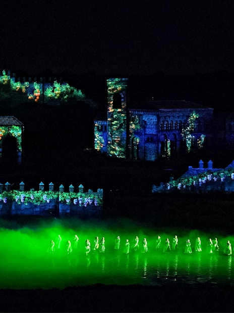 Performers in illuminated costumes at The Dream of Toledo night show, Spain.