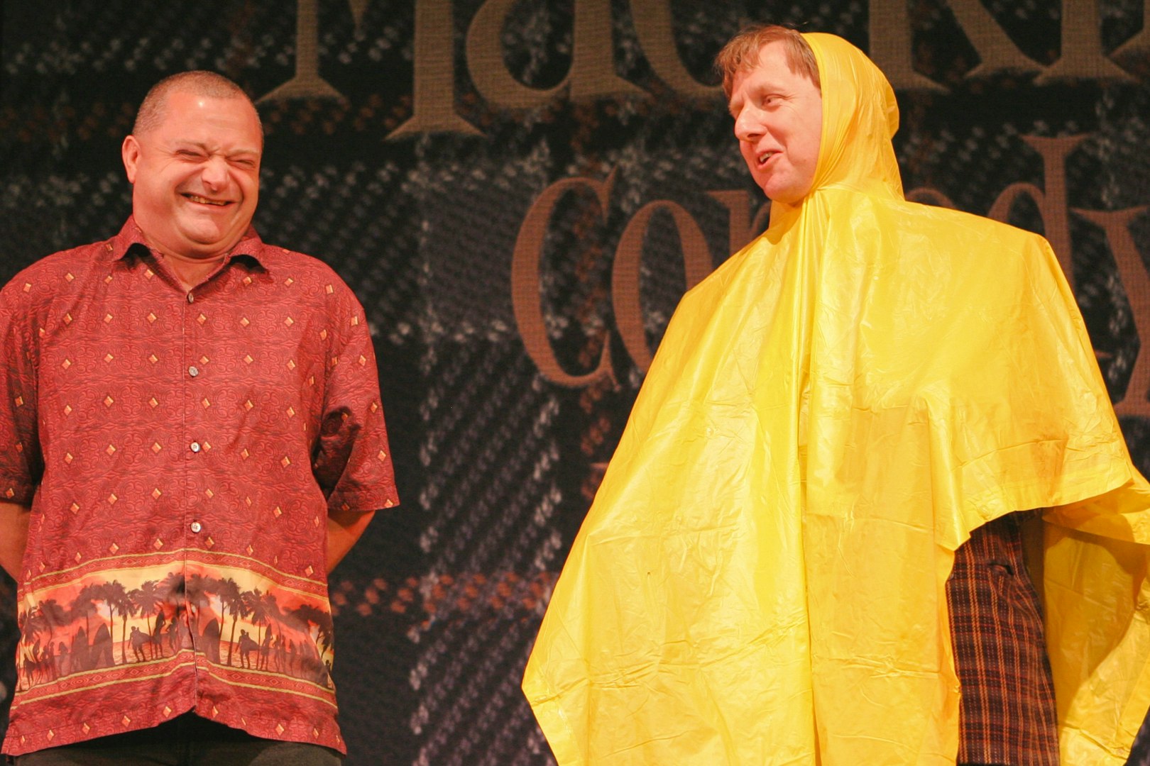 Two performers on stage during The Mac King Comedy Magic Show in Vegas.