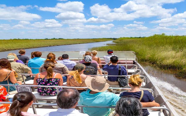 View of guests enjoying Airboat experience during Everglades Safari Park