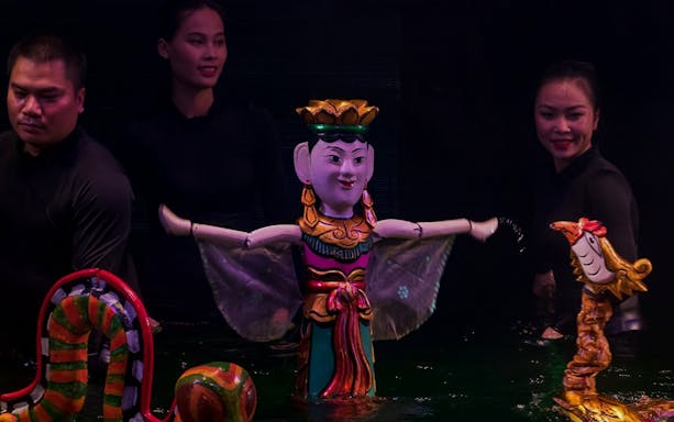 Performers with puppets at Thang Long Water Puppet Show in Hanoi, Vietnam.
